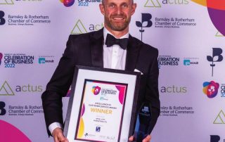 James Biggin holding the Barnsley And Rotherham Customer Service Award