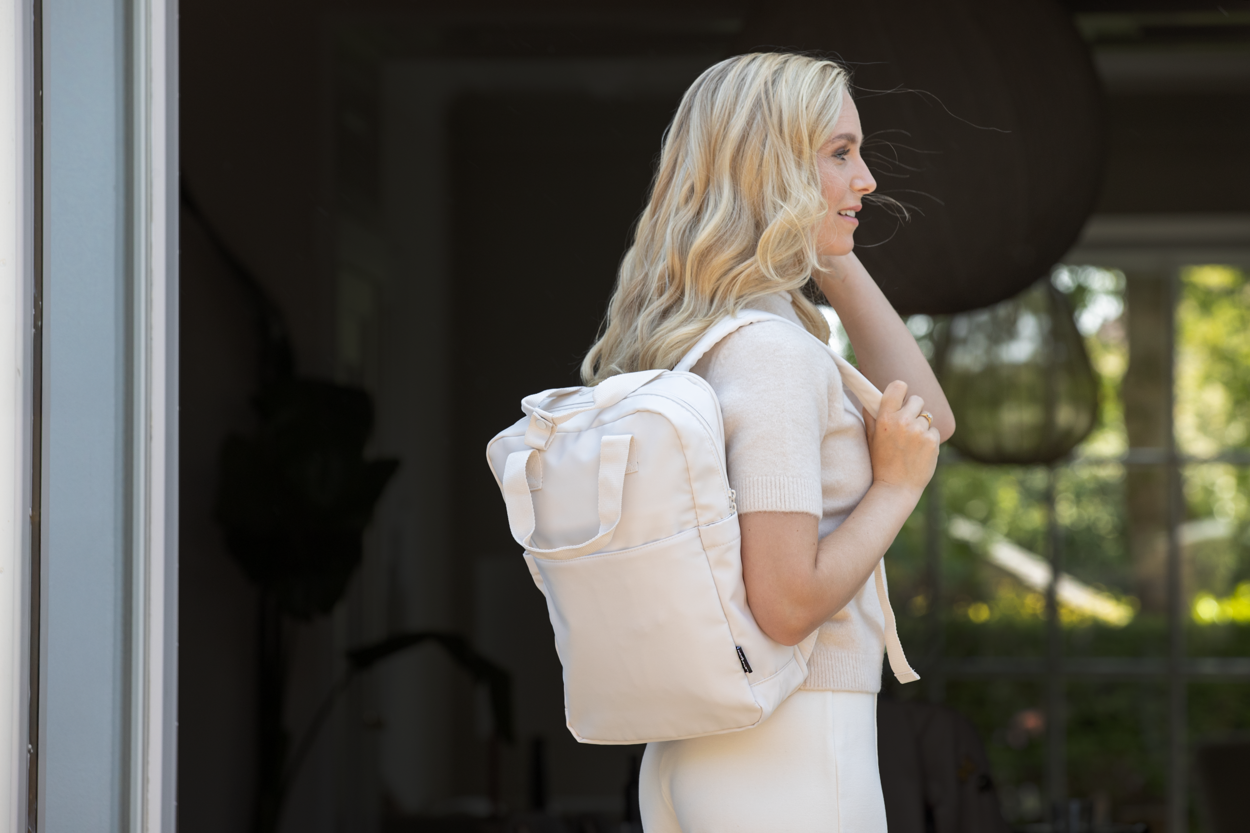Woman with a branded backpack